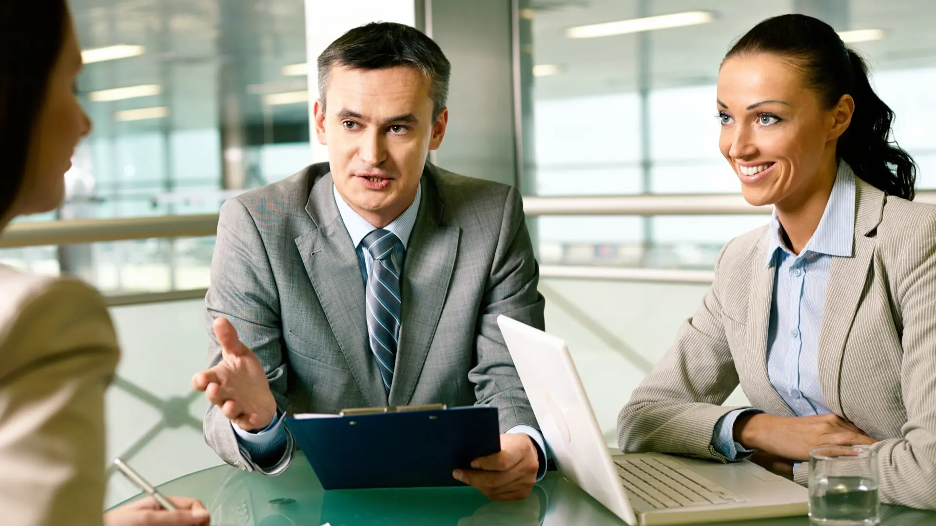 Hiring managers and HR leaders discussing candidate decisions during the hiring process