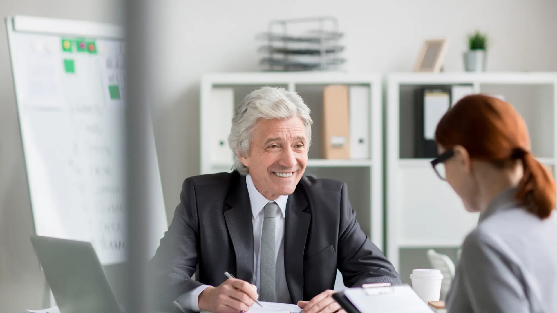 Senior professional addressing overqualification concerns in job interview